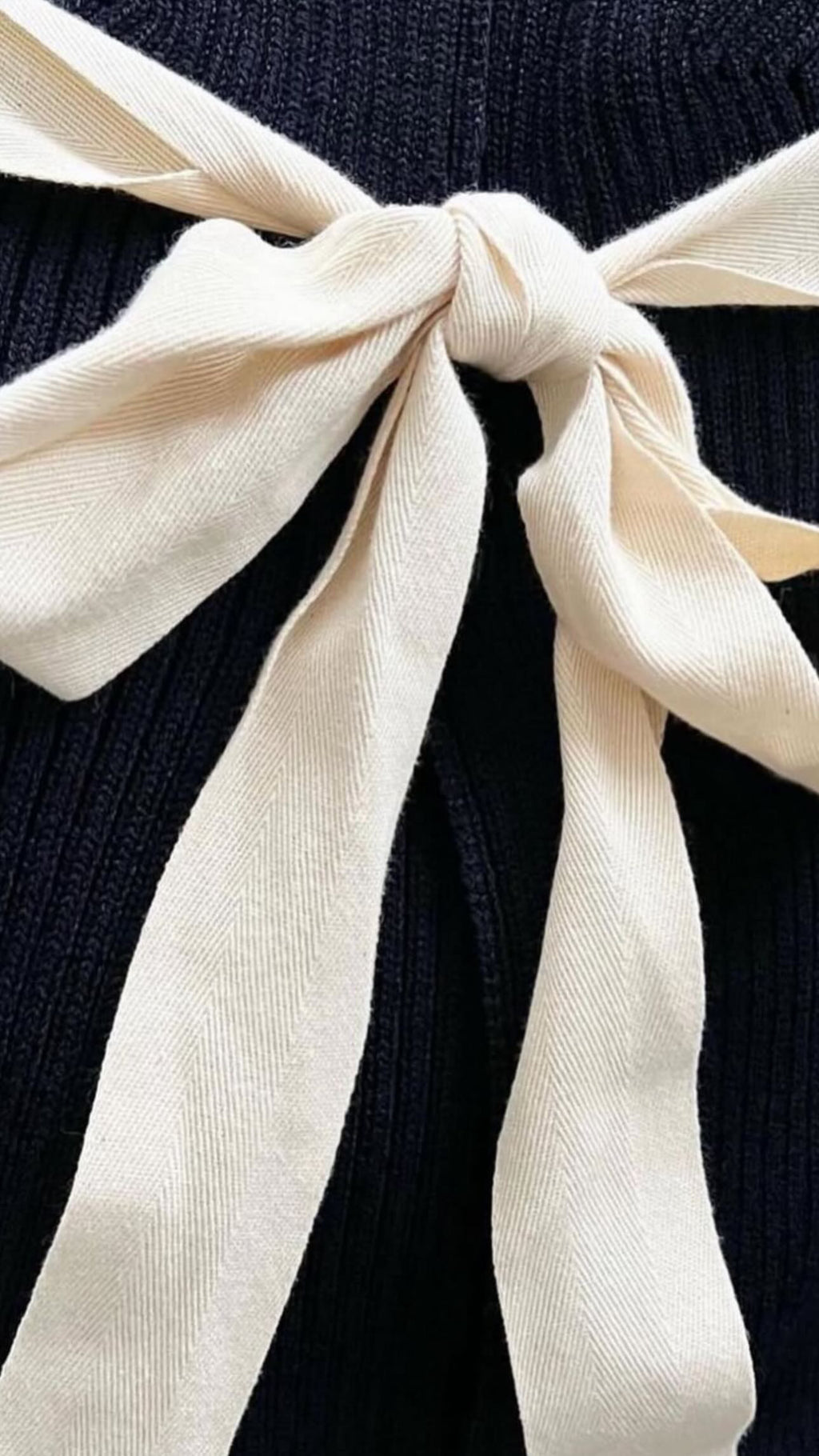 The Open Back Ribbed Cardigan with Iconic White Ribbons