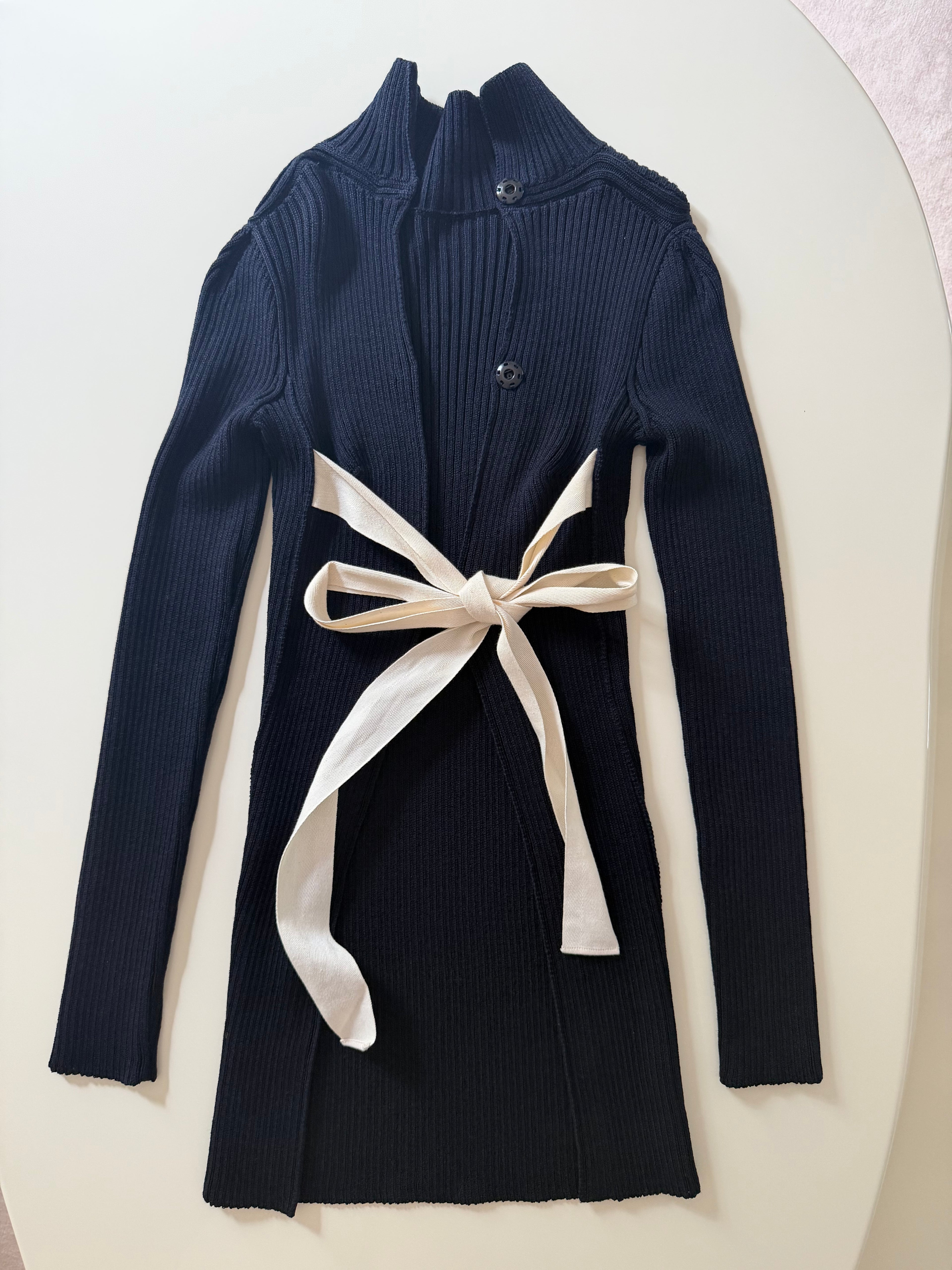 The Open Back Ribbed Cardigan with Iconic White Ribbons