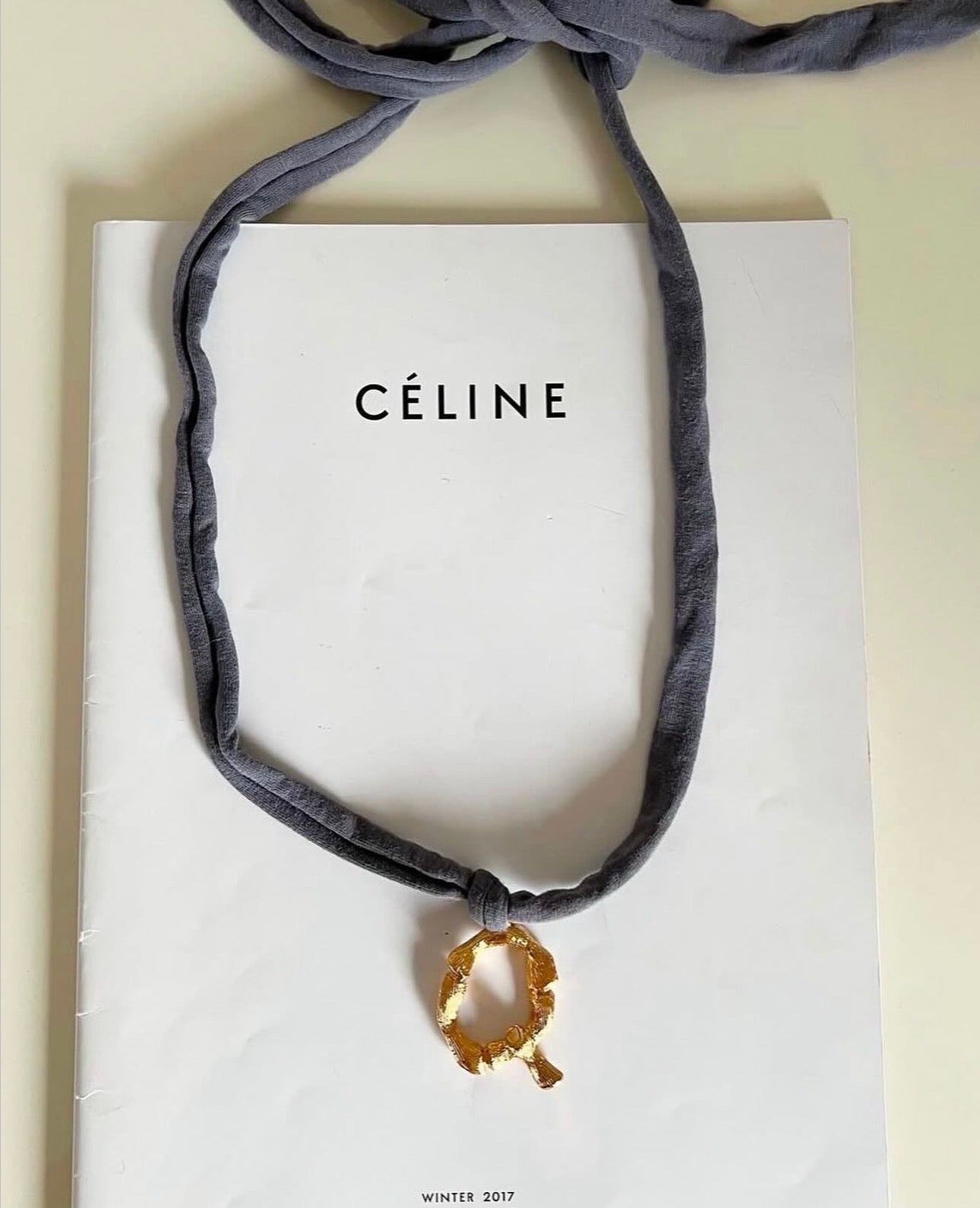 The Alphabet Jersey „Q“ Necklace in Blue Grey Jersey and Gold Brass