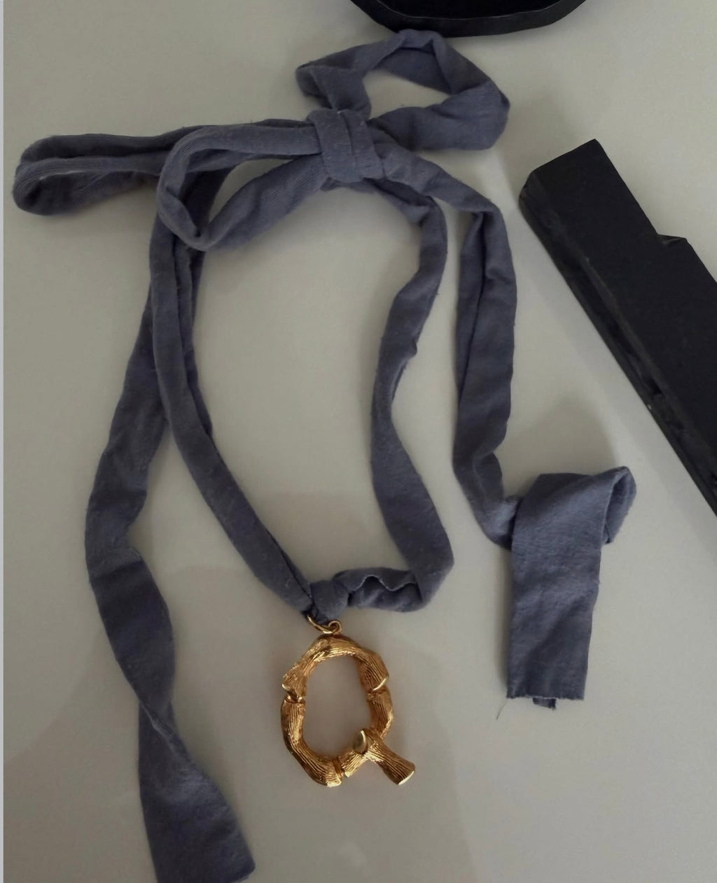 The Alphabet Jersey „Q“ Necklace in Blue Grey Jersey and Gold Brass