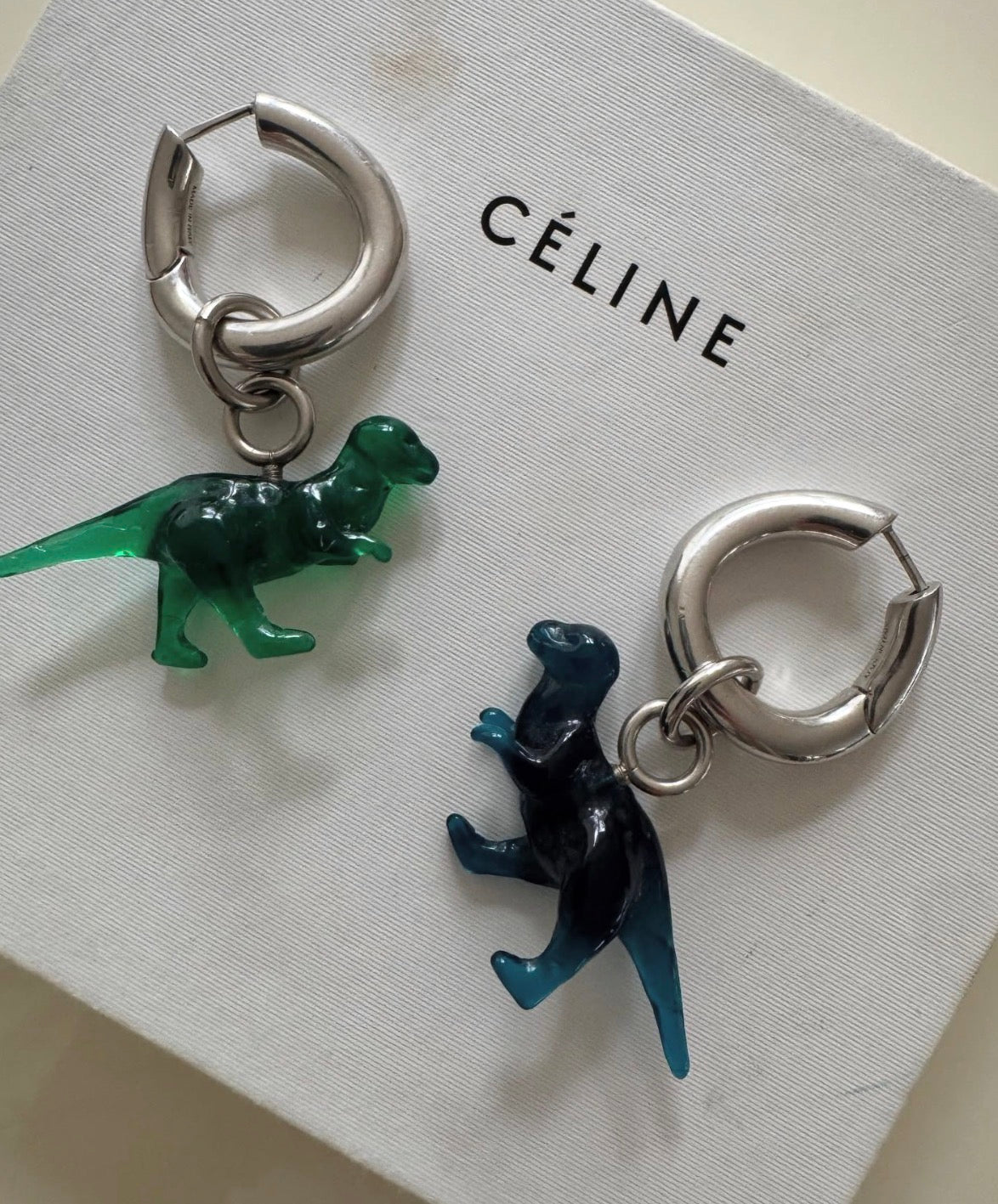 The Toy Small Dinosaur Earrings in Blue And Green Resin